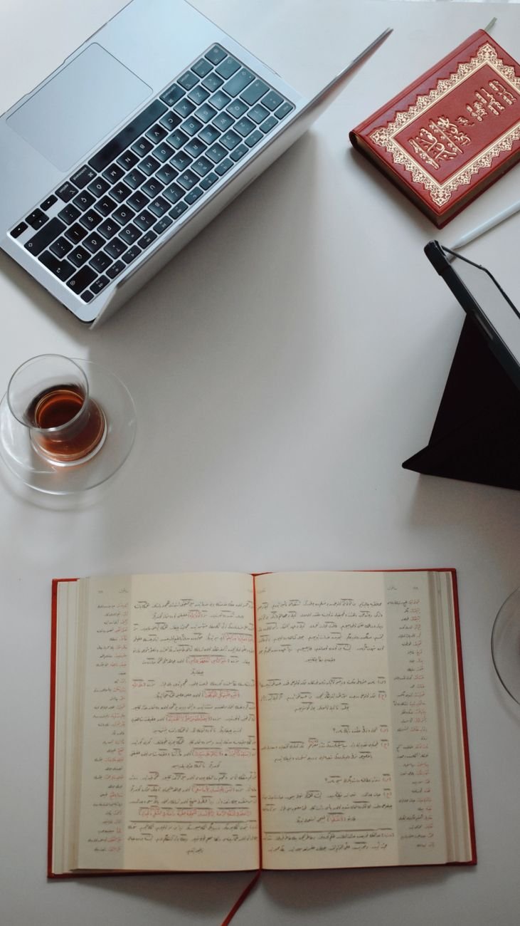 flat lay of notebook laptop and tea on desk